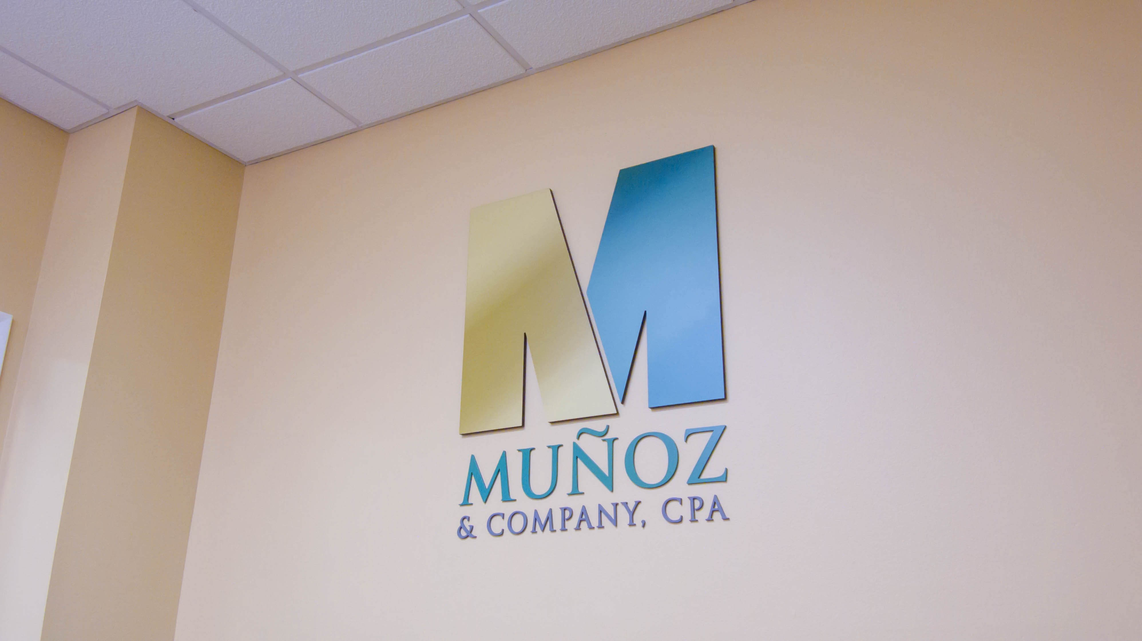 Munoz & Company, CPA - Logo on Wall